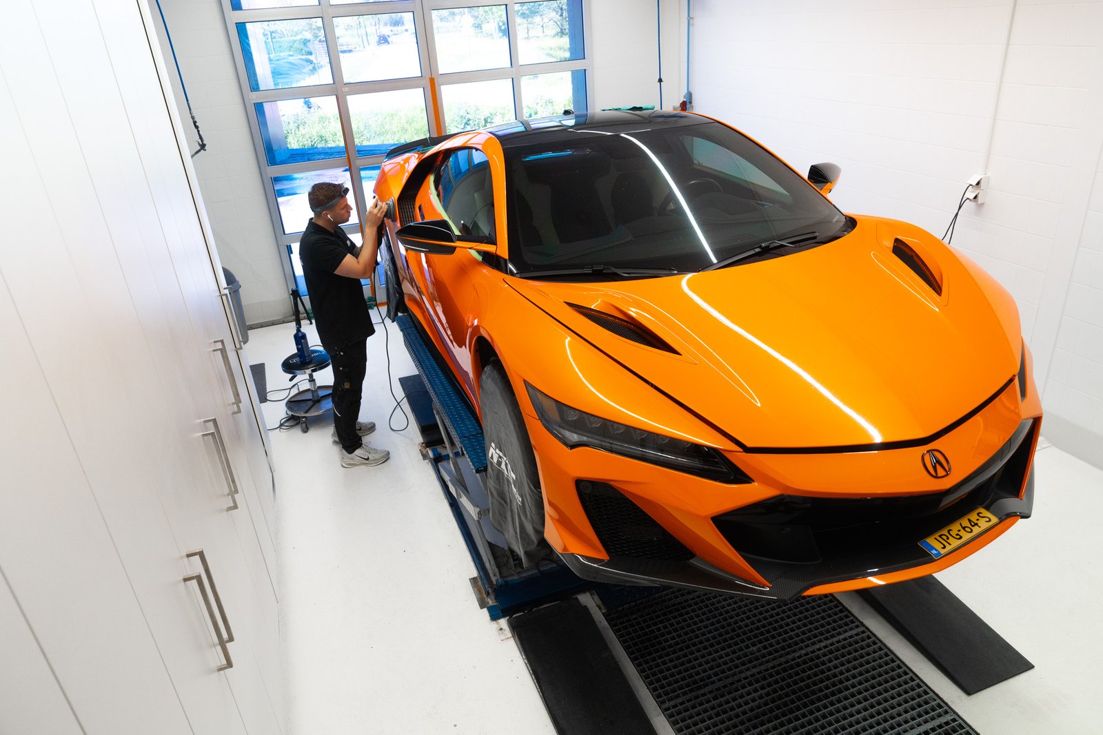 Photo of work on a car at a detailing business