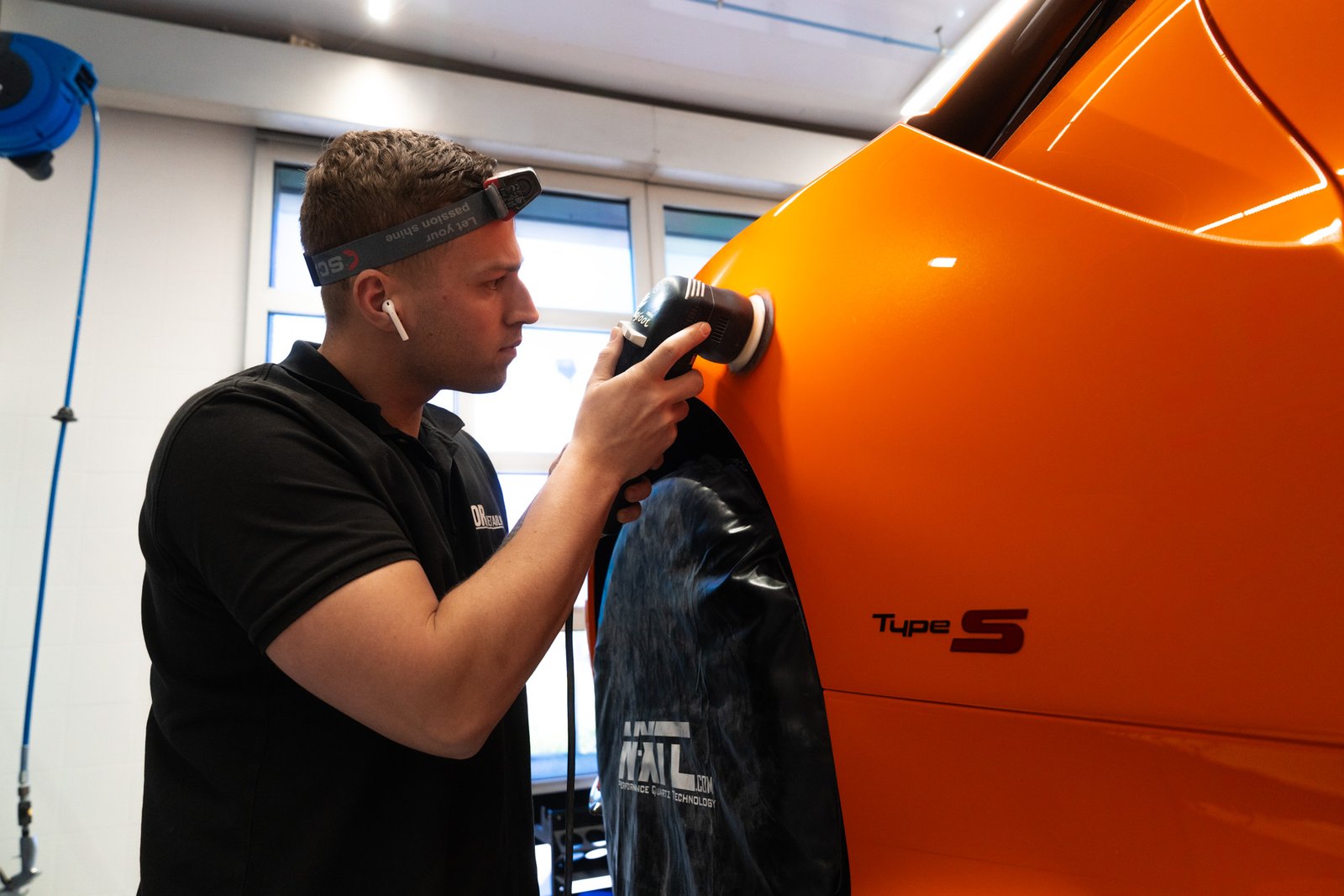 Photo of work on a car at a detailing business