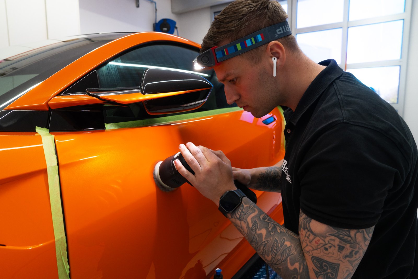 Photo of work on a car at a detailing business