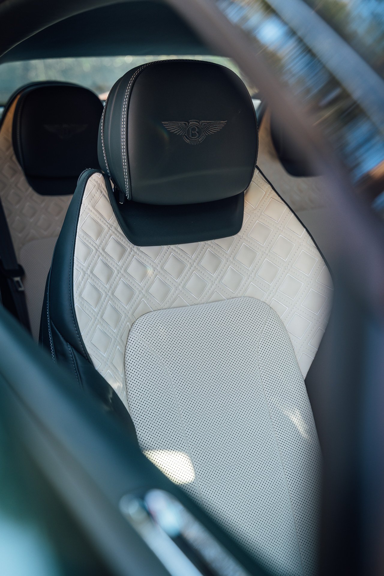 Interior of a Bentley Continental GT. White seats
