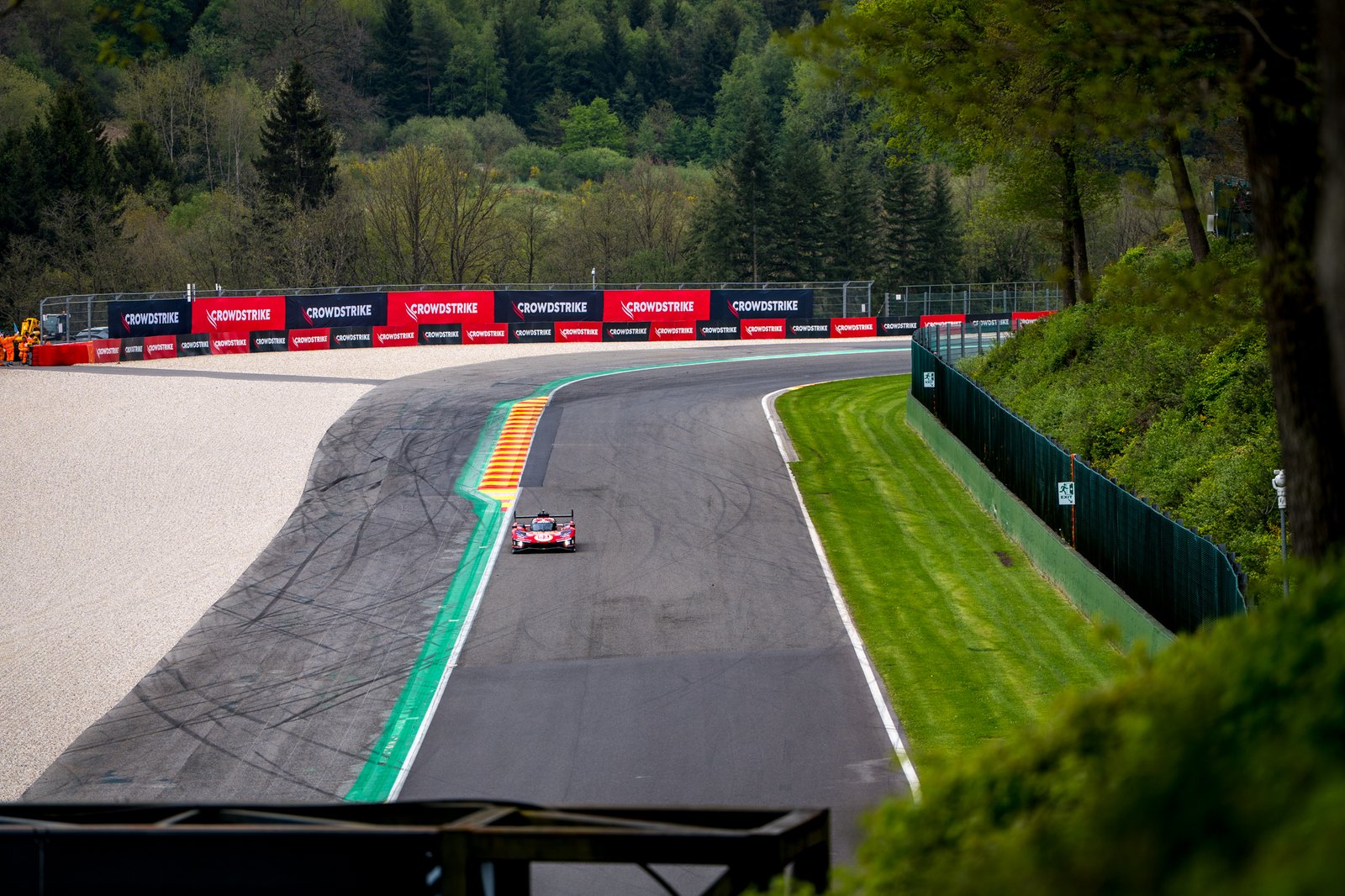 Wide shot of a Ferrari hypercar on track