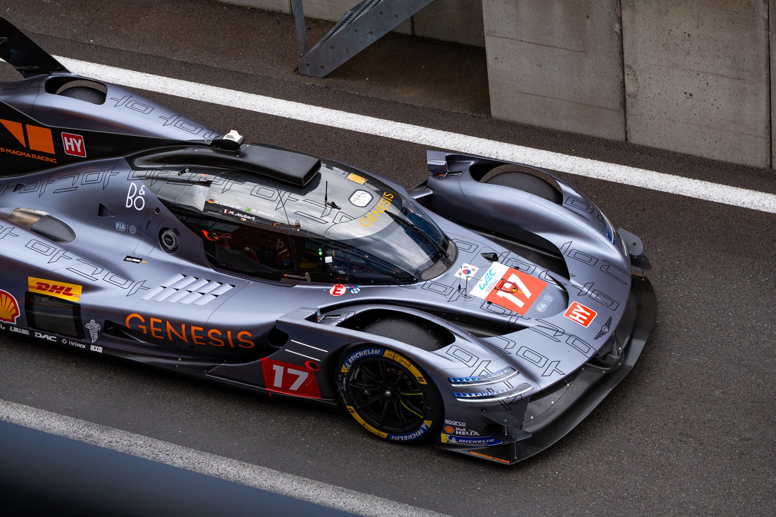 Close-up shot of the Genesis hypercar flying through pitlane