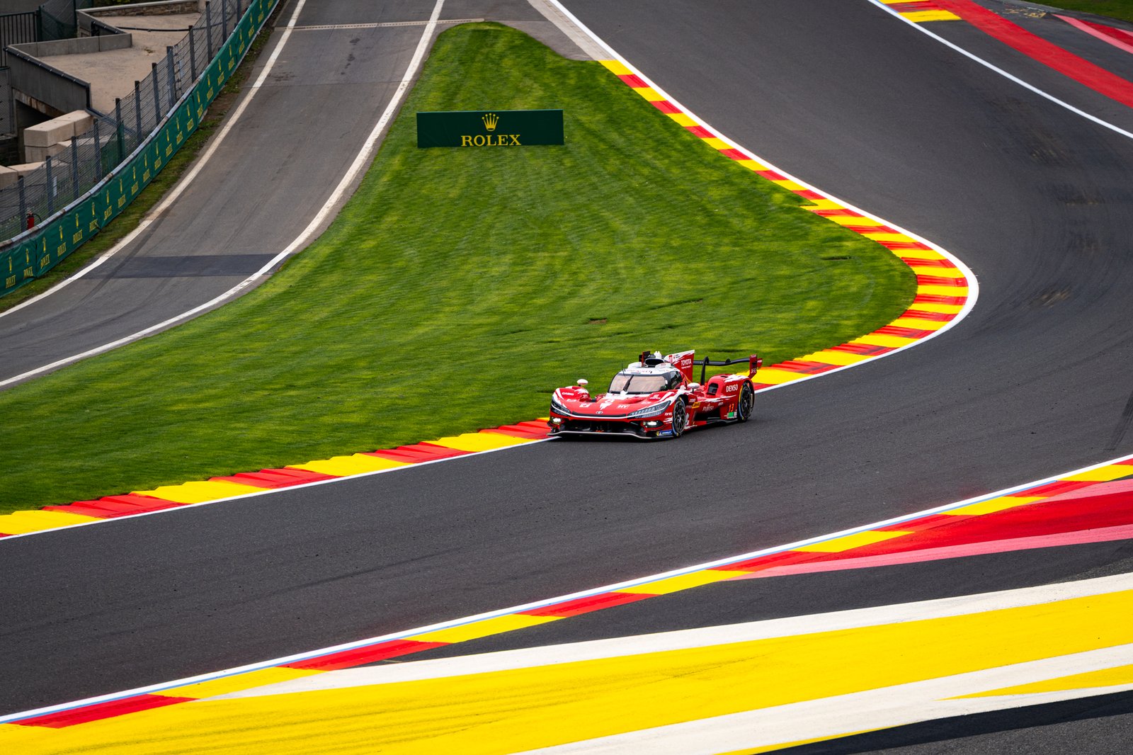 Toyota hypercar flying through Eu Rouge