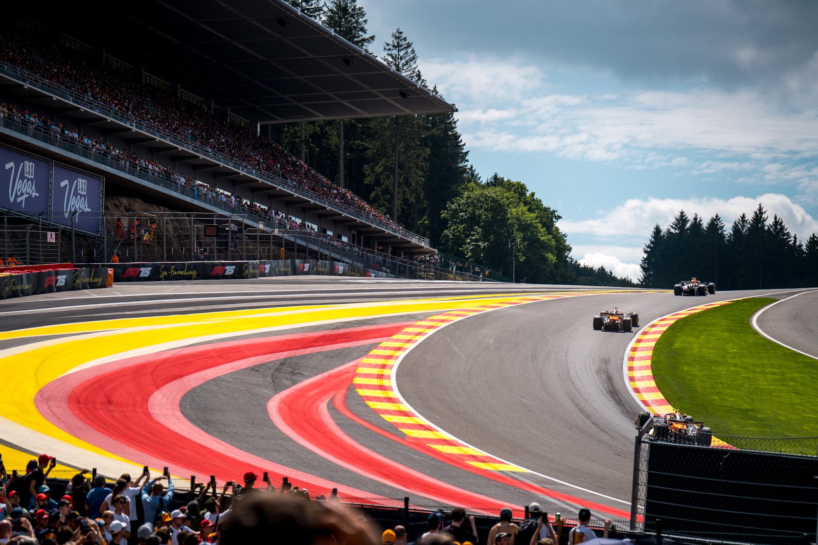 F1 2025, 3 F1 cars. going through Eu Rouge and Raidillon