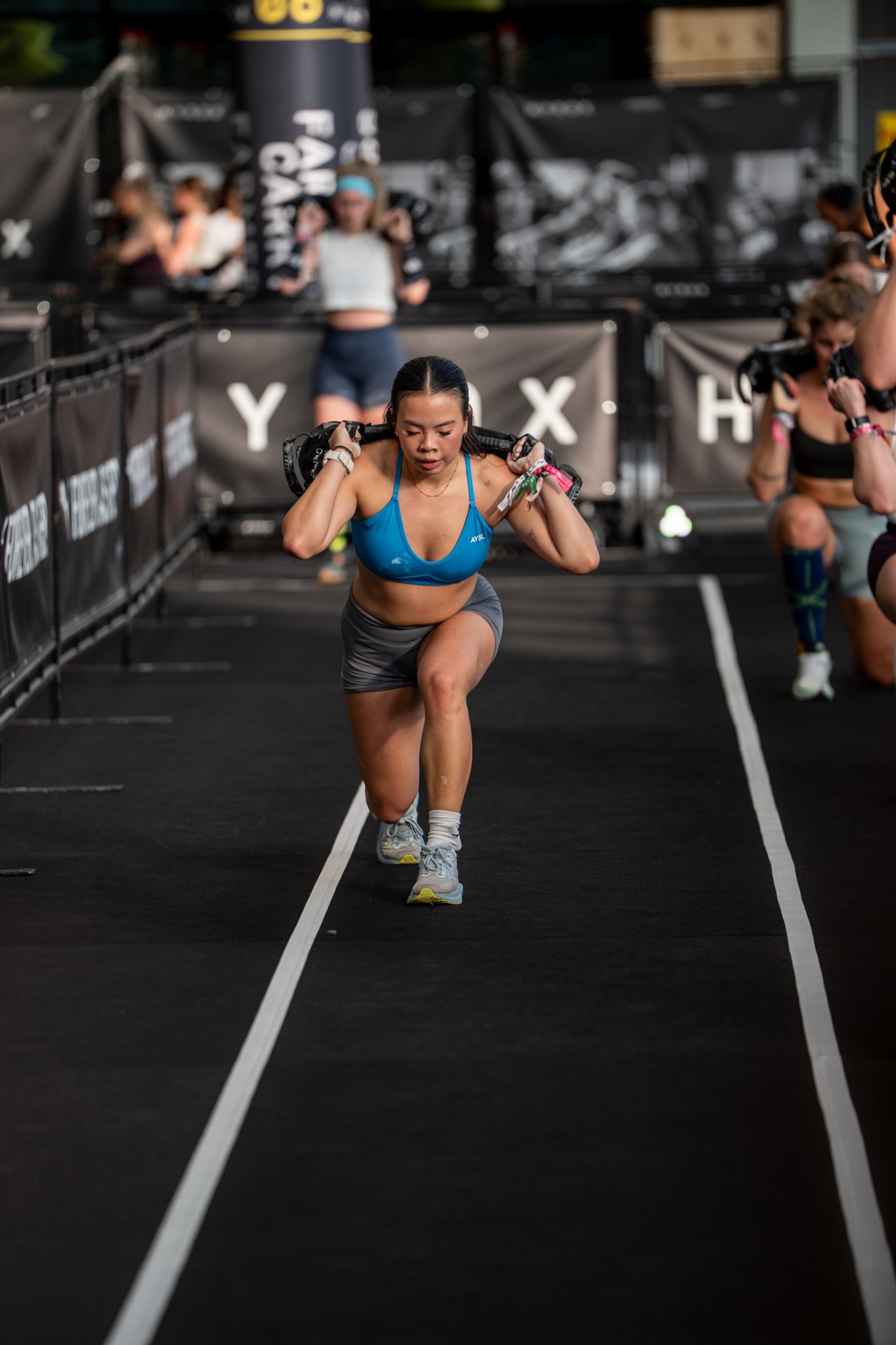 lunges with a sandbag on back