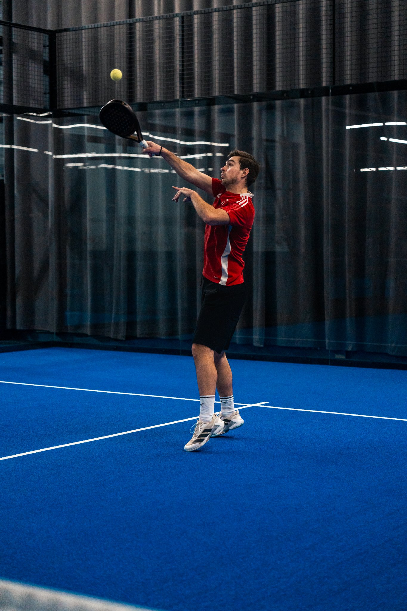 Overhead return during a padel match