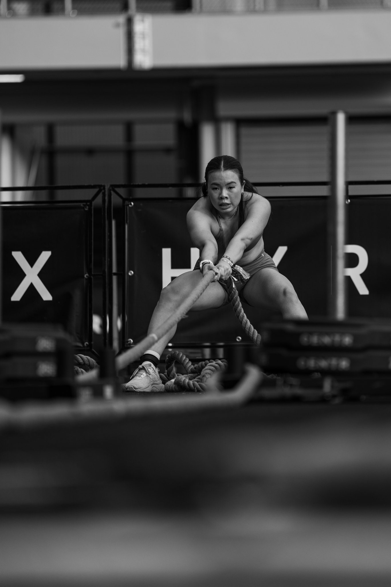 Black and white image of sled pull during Hyrox event